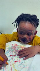 Child with Marker on His Face Plays Innocent