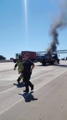 Fireman Extinguish Car That Caught Fire on Tow Truck