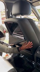 Video screen and carbon fibre detail in the Rolls-Royce Black Badge Ghost’s rear