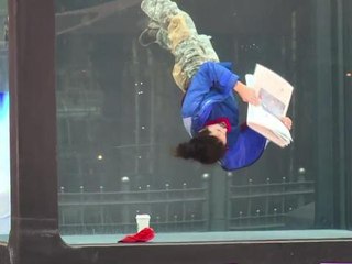 Performers enact daily routines in underwater tank in London