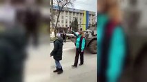 Man jumps on Russian tanks and raises Ukranian flag during protests in Kherson