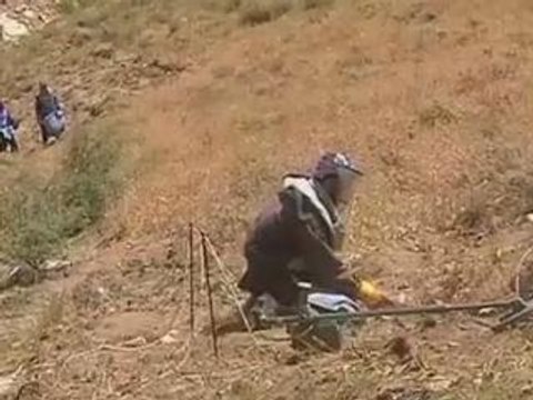 Cash cuts and violence hit Afghan demining