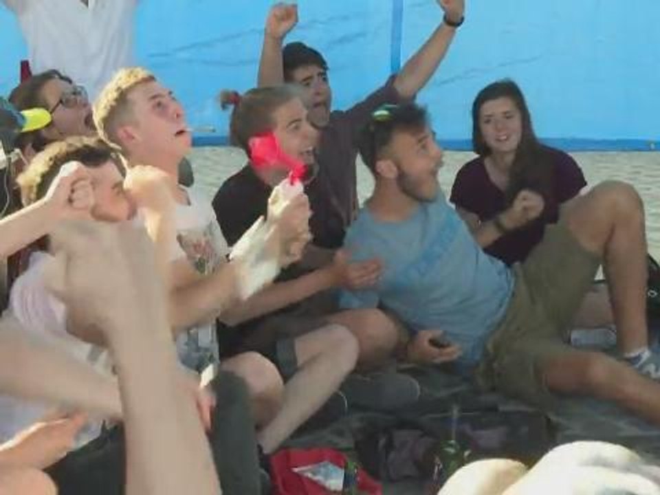 Italian football fans in Rome cheer on Italy goal