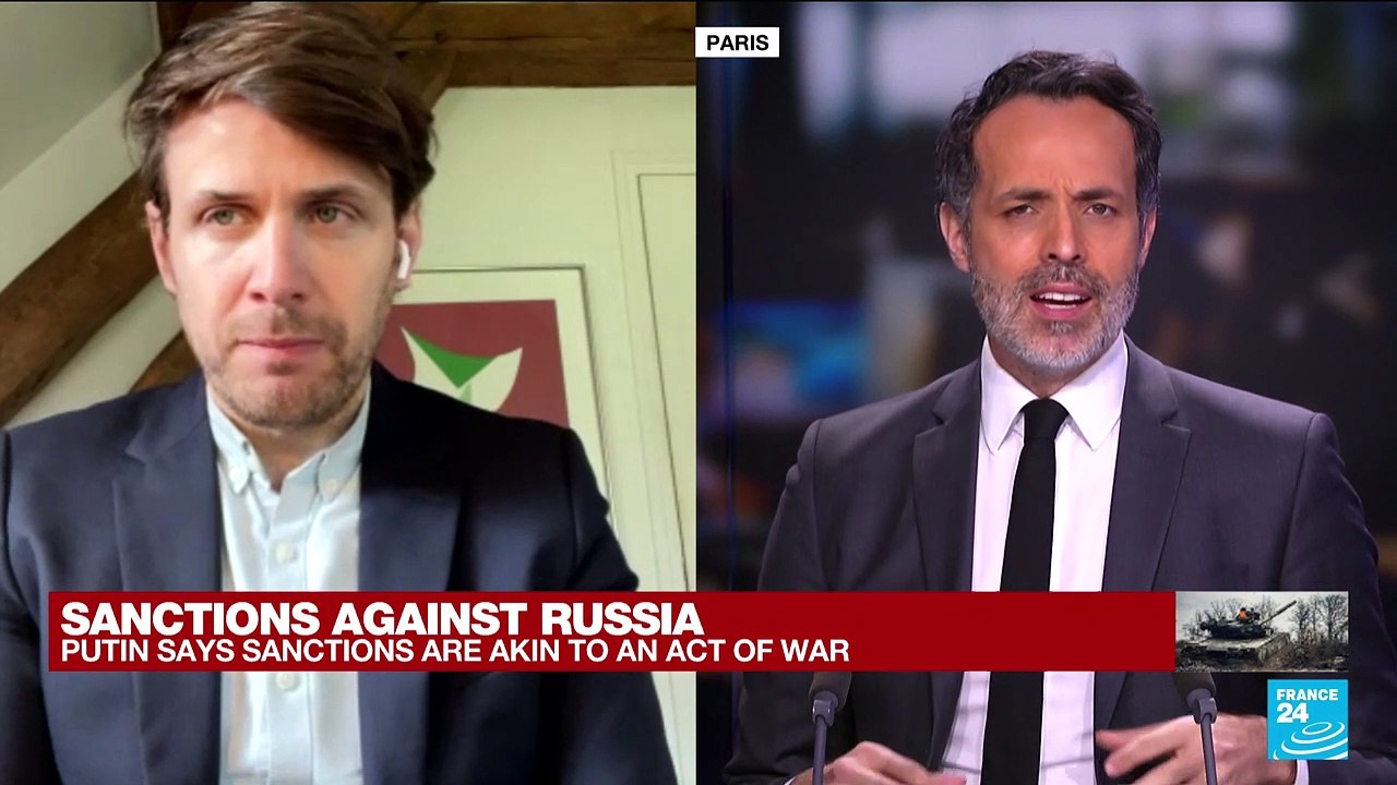 Putin likens Western sanctions to war as Russian assault traps Ukrainian civilians