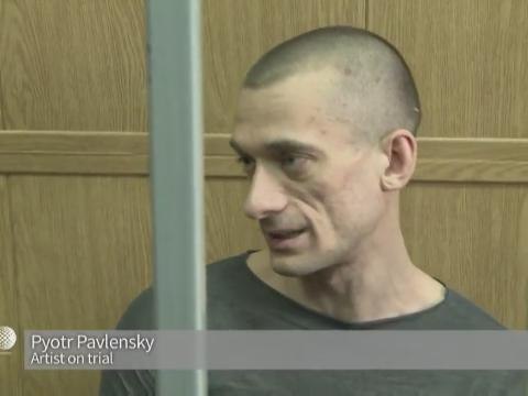 Russian artist on trial for torching security service HQ door