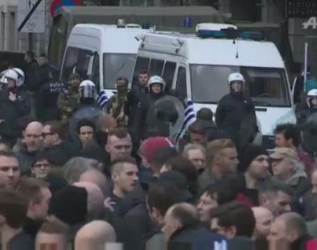 Riot police clash with far-right hooligans at Brussels shrine