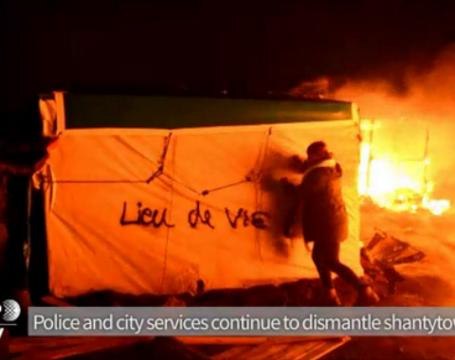 Activists,migrants try to salvage shacks at Calais 'Jungle' camp