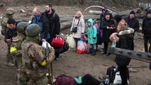 Ukrainians flee fighting north of Kyiv over bombed-out bridge - AFP
