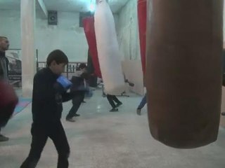 In Syria's Aleppo city, young boys box to drown out bombs