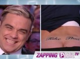 Zapping PublicTV n°562 : Antoine de Caunes montre ses fesses tatouées à Robbie Williams !
