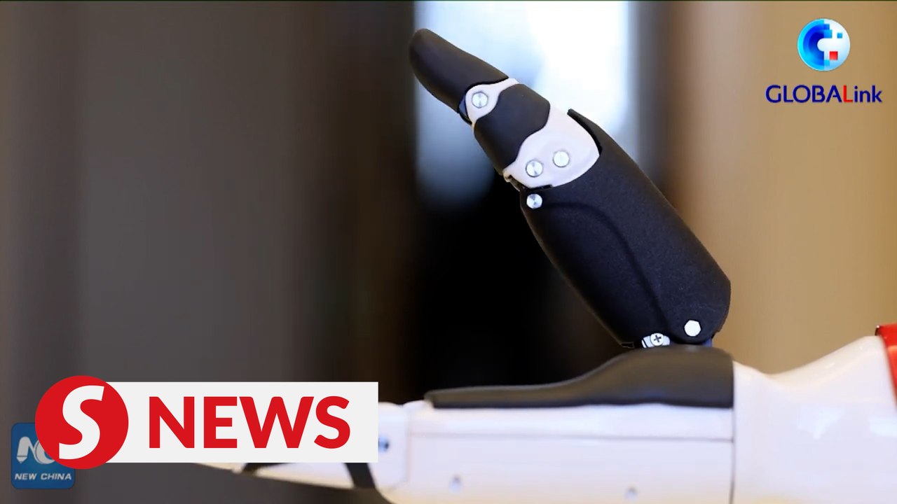 Wearable exoskeleton robot helps Beijing 2022 Paralympic torchbearer