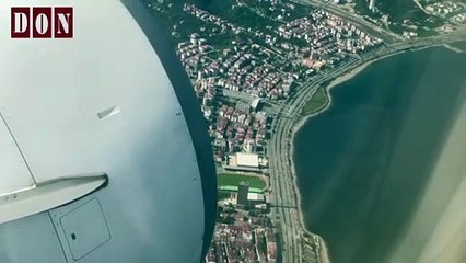 View From An Airplane Window Flying Above The Clouds