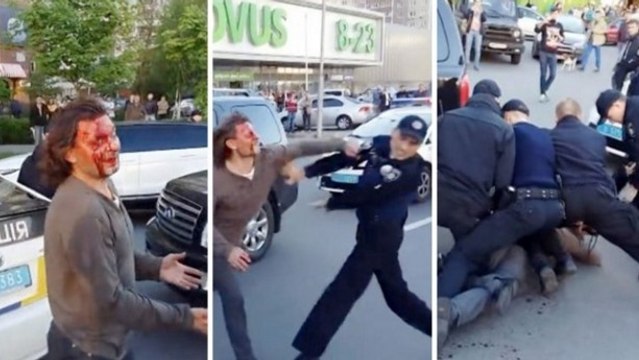 Vyacheslav Oliynyk, médaillé d'or en lutte aux JO d'Atlanta, se bat avec une horde de policiers