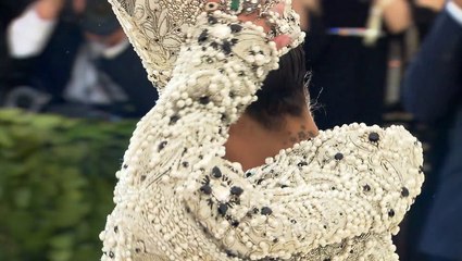 Rihanna Displays Bare Baby Bump In Tiny Snakeskin Crop Top After Returning From PFW