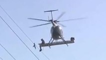Regardez cet hélicoptère venir en aide à un oiseau pris au piège dans des câbles électriques