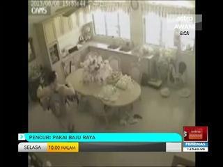 Pencuri pakai baju raya