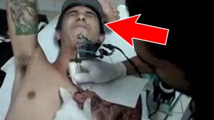 Il souffre le martyr en se faisant tatouer un dragon sur la poitrine