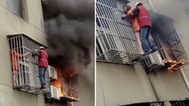 Chine : Un homme sauve une femme d'un immeuble en flammes