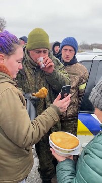 Ukrainian channels of a captured Russian soldier apparently being fed by locals.
