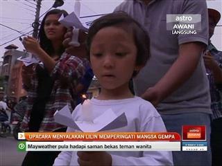 Upacara menyalakan lilin memperingati mangsa gempa