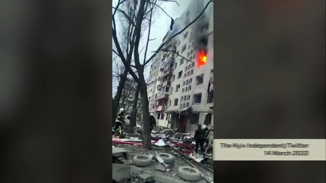 Ukrainian Firefighters are putting out fire in a shelled 9-story apartment block
