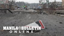 Civilians, killed soldiers evacuated across destroyed bridge near Kyiv