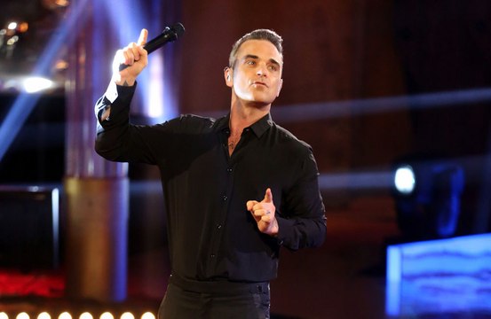 'There are these great wigs that you can get now': Robbie Williams says he may get a wig for touring following failed hair transplant