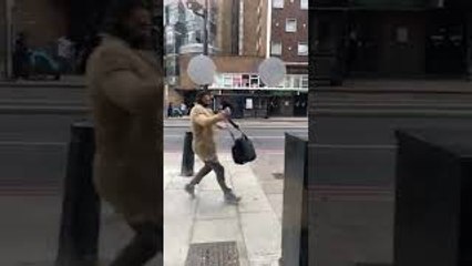 Storm Eunice Blows Away Pedestrians