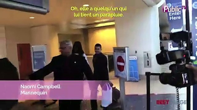Exclu Vidéo : Naomi Campbell : ras-le-bol des paparazzi, elle se cache derrière un parapluie à LAX !