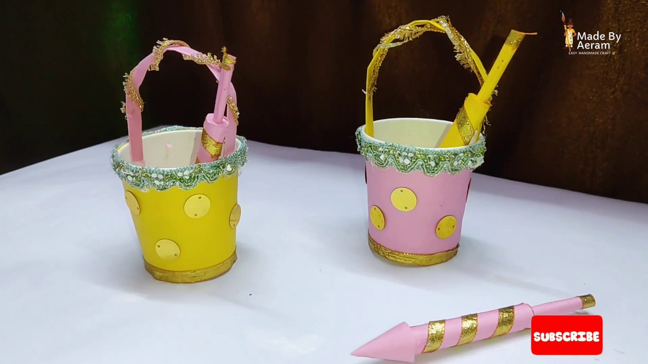 Colourful mini Holi bucket with pichkari for kids