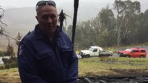 Fire investigators inspect rubble at Cradle Mountain