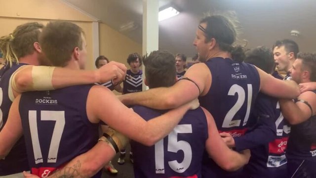 Burnie Dockers players singing the club song after Saturday's NWFL win over Ulverstone