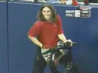 Kid Ringing Bell at Football Game