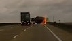 Intense winds blow cargo off a truck, crushing a South Carolina police car