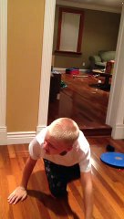 Boy rides piece of cardboard down stairs head first