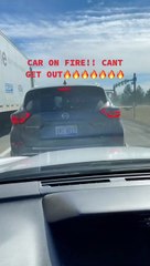 Person Drives a Car Actively on Fire Through Traffic