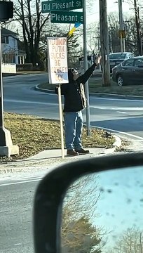 Guy at Stoplight Shares Opinion of Vladimir Putin on Sign
