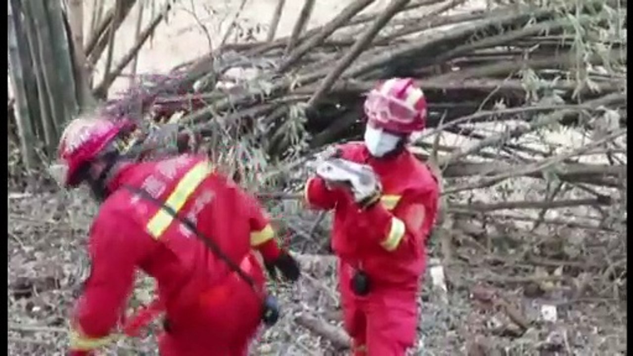 Rescuers rush to the plane crash site in southern China