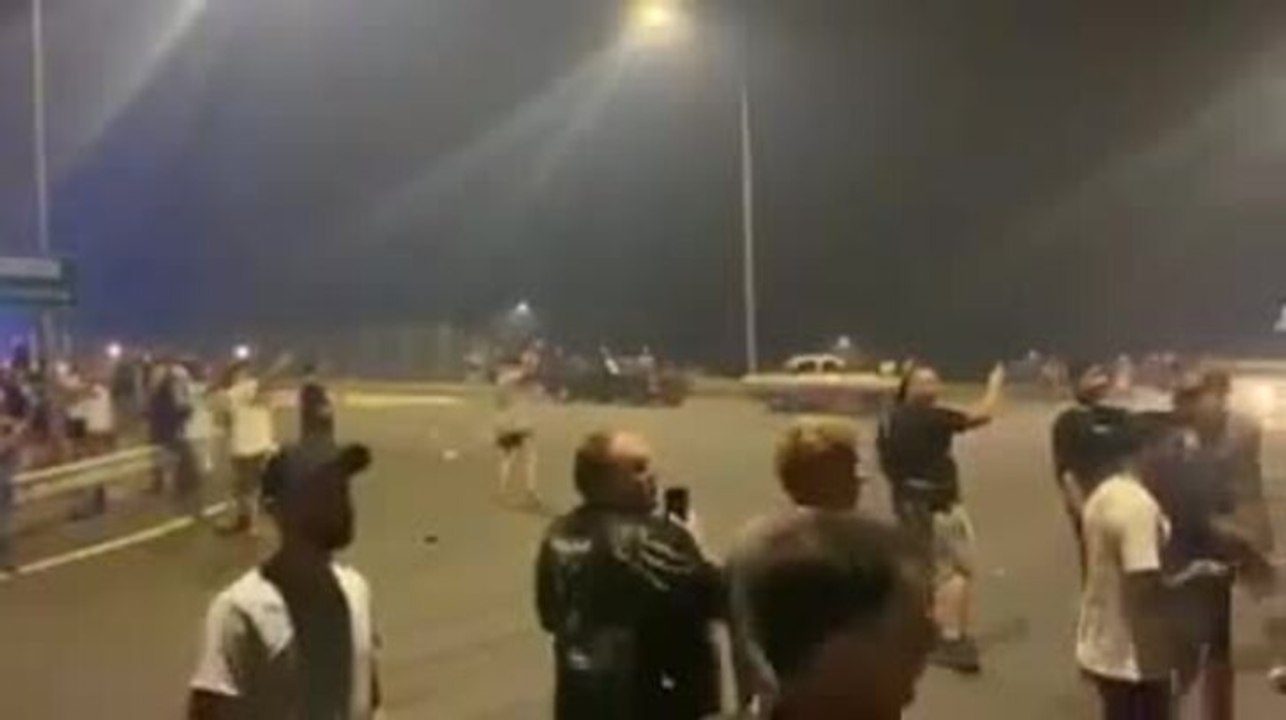 Crowd hurls rocks, bottles at police. Videos: Trai Hildebrand/Facebook and supplied