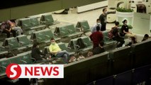 Relatives and colleagues of Chinese plane crash victims gather at Guangzhou airport