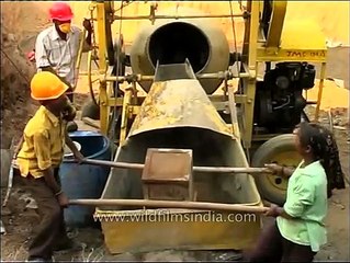 Hydraulic type old concrete mixer machine in use in India
