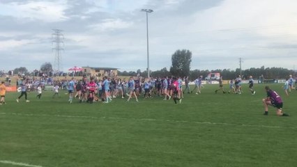 Tumut supporters flood the field after Blues win