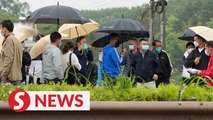 Downpour halts China's search for jet crash victims
