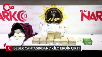 Kucağındaki bebeğin çantasında 7 kilo eroin ele geçirildi
