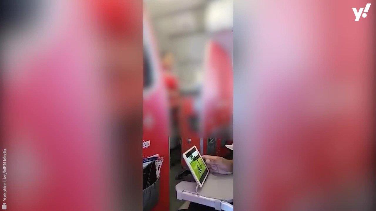 Moment plane erupts with cheers as out of contr...
