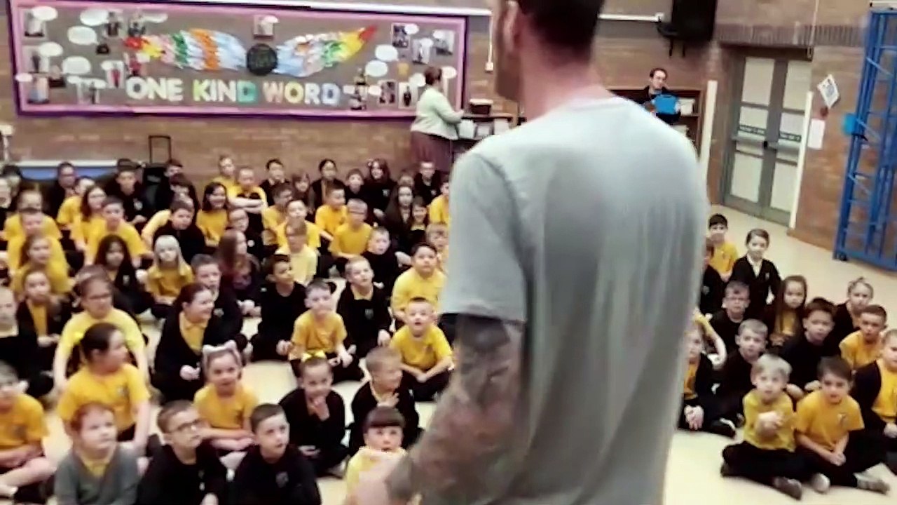 Worlds tallest basketball player Paul Sturgess at Fatfield Academy