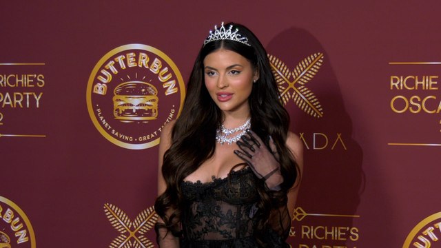 Holly Scarfone attends Darren Dzienciol and Richie Akiva’s Oscar Party 2022 red carpet event