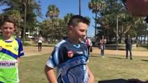 Phil Sigsworth presents footy boots to Port Macquarie-Hastings juniors