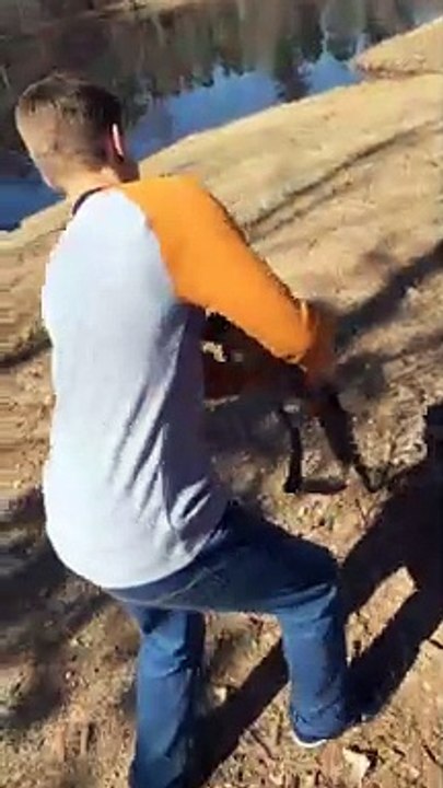 Kid shoots gun at shooting range