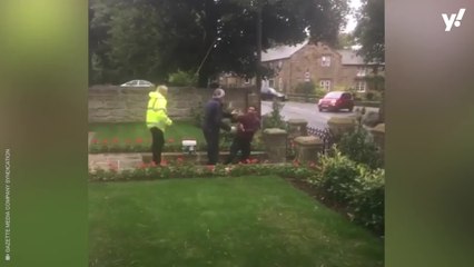 Watch pensioner assault neighbour in front of six-year-old child at war memorial